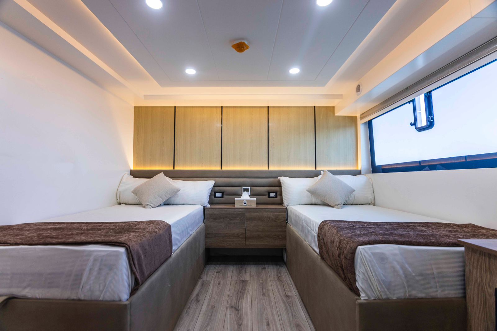 Cabin with two beds onboard the charter vessel