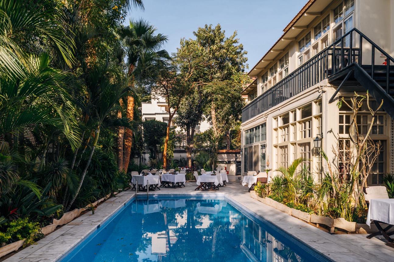Private dinner setting by the pool at Villa Belle Époque, Cairo