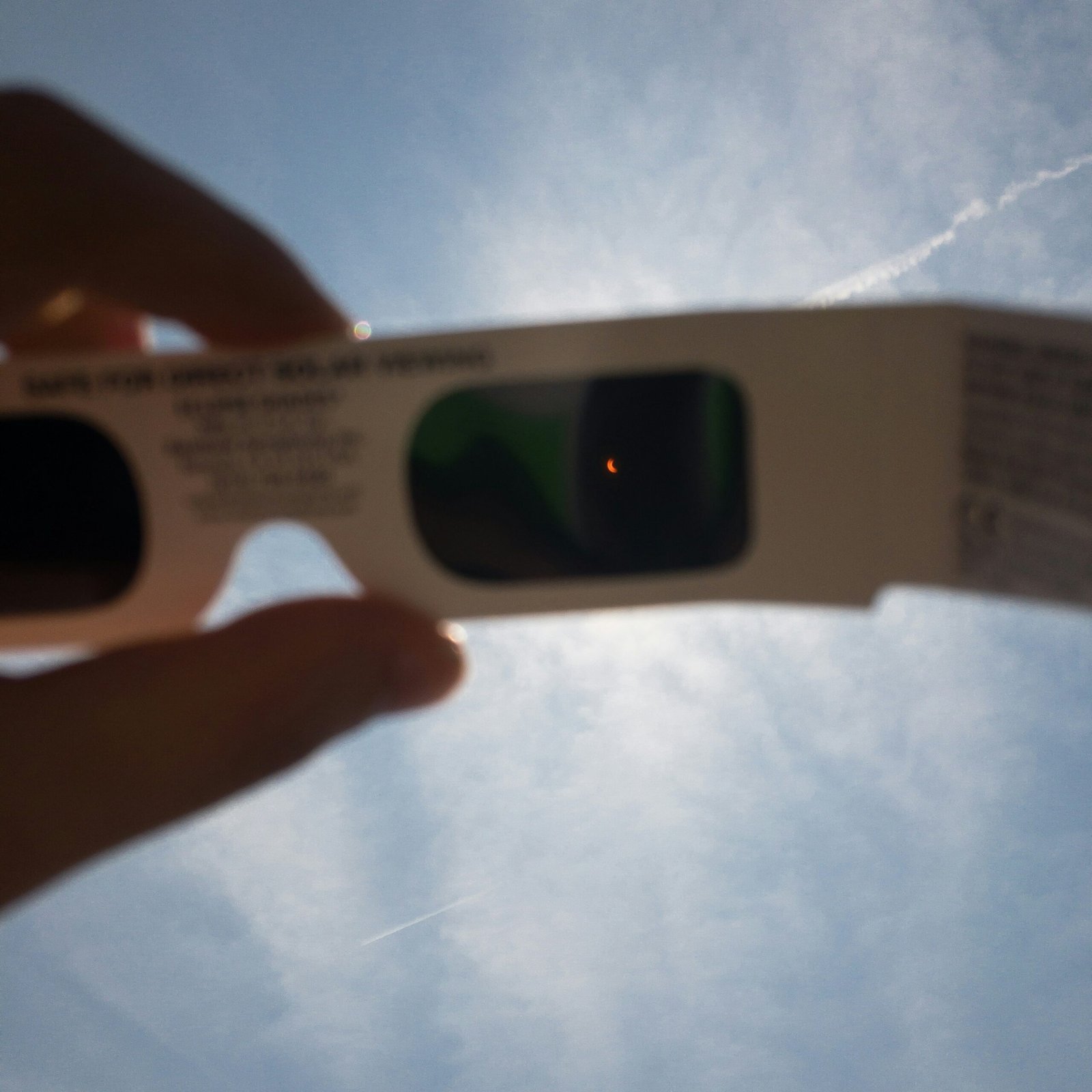 Watching a solar eclipse through certified eclipse glasses