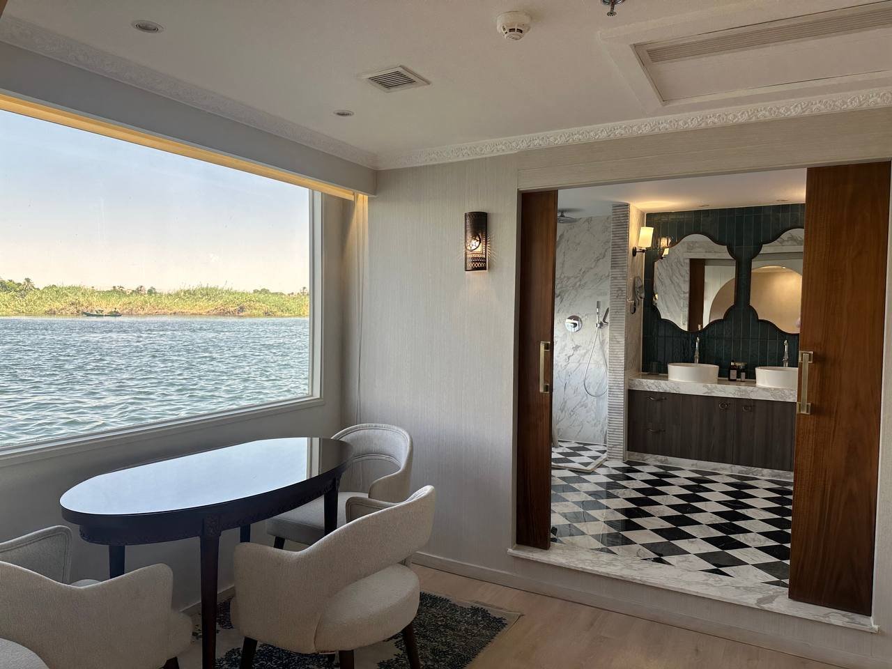 Nawara — suite dining area and marble bathroom