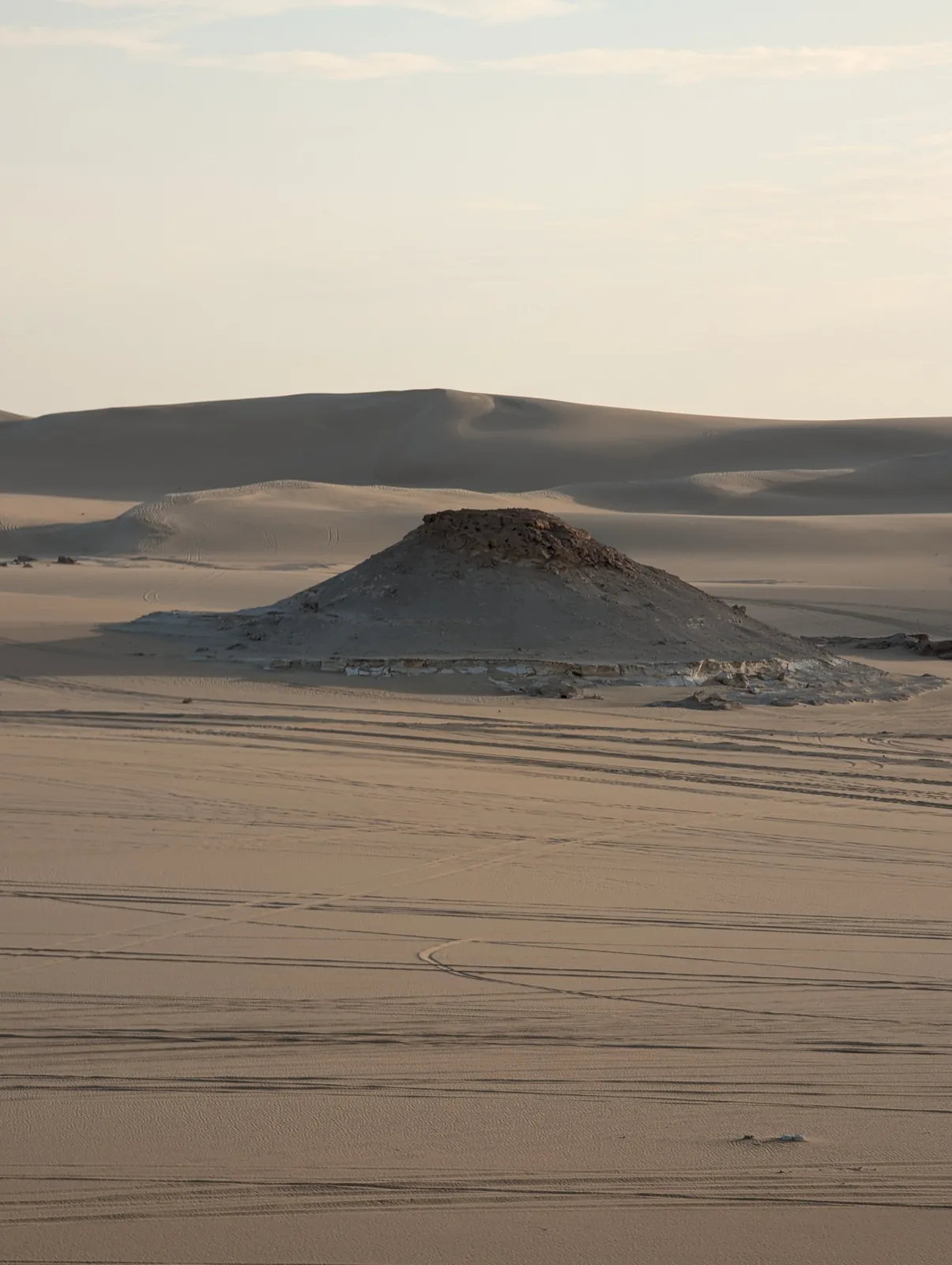 Empty desert hill under open sky near Siwa, Egypt